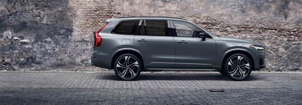 2020 volvo xc90 parked by a stone wall
